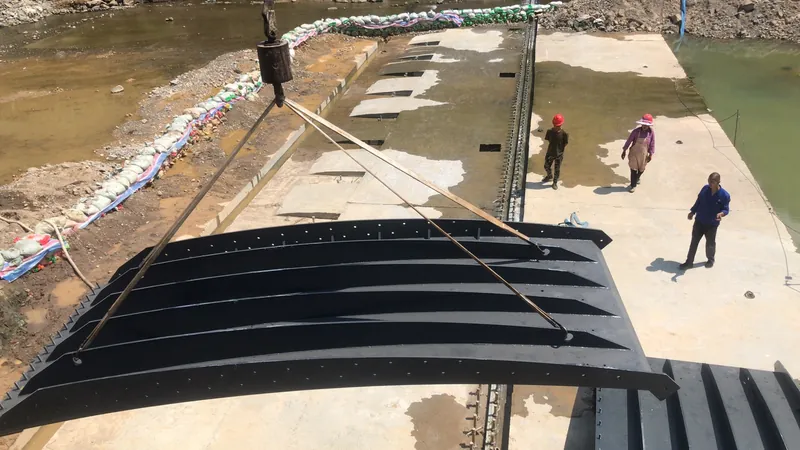 Steel shield plates lifted into position